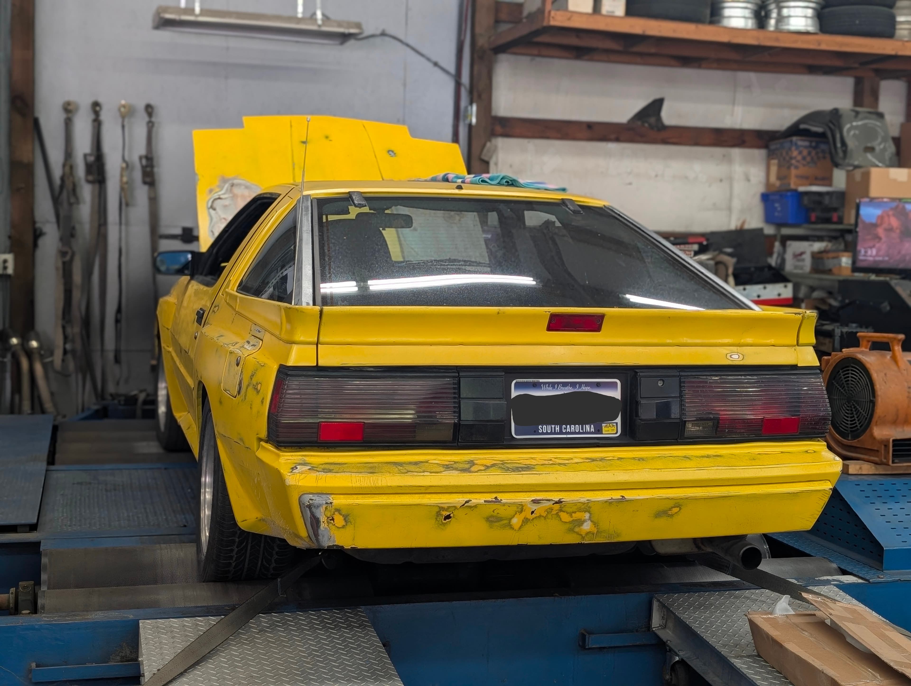 Yellow drift car on the shop rack